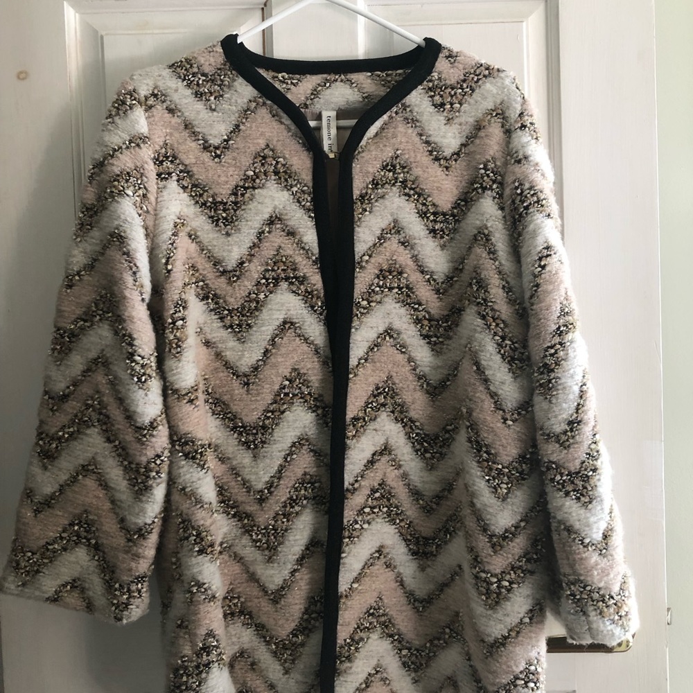 Suiting overcoat for indoor wear. Made w/ wool and a poly-blend detailing.